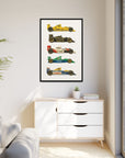 Framed poster of vintage racing cars on a wall above a white cabinet.