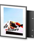 Bright and colorful framed Poster featuring Ayrton Senna in his Marlboro McLaren Formula One car.