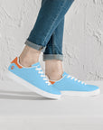 Gulf Racing sneakers worn by model - a perfect combination of motorsports heritage and modern street style.