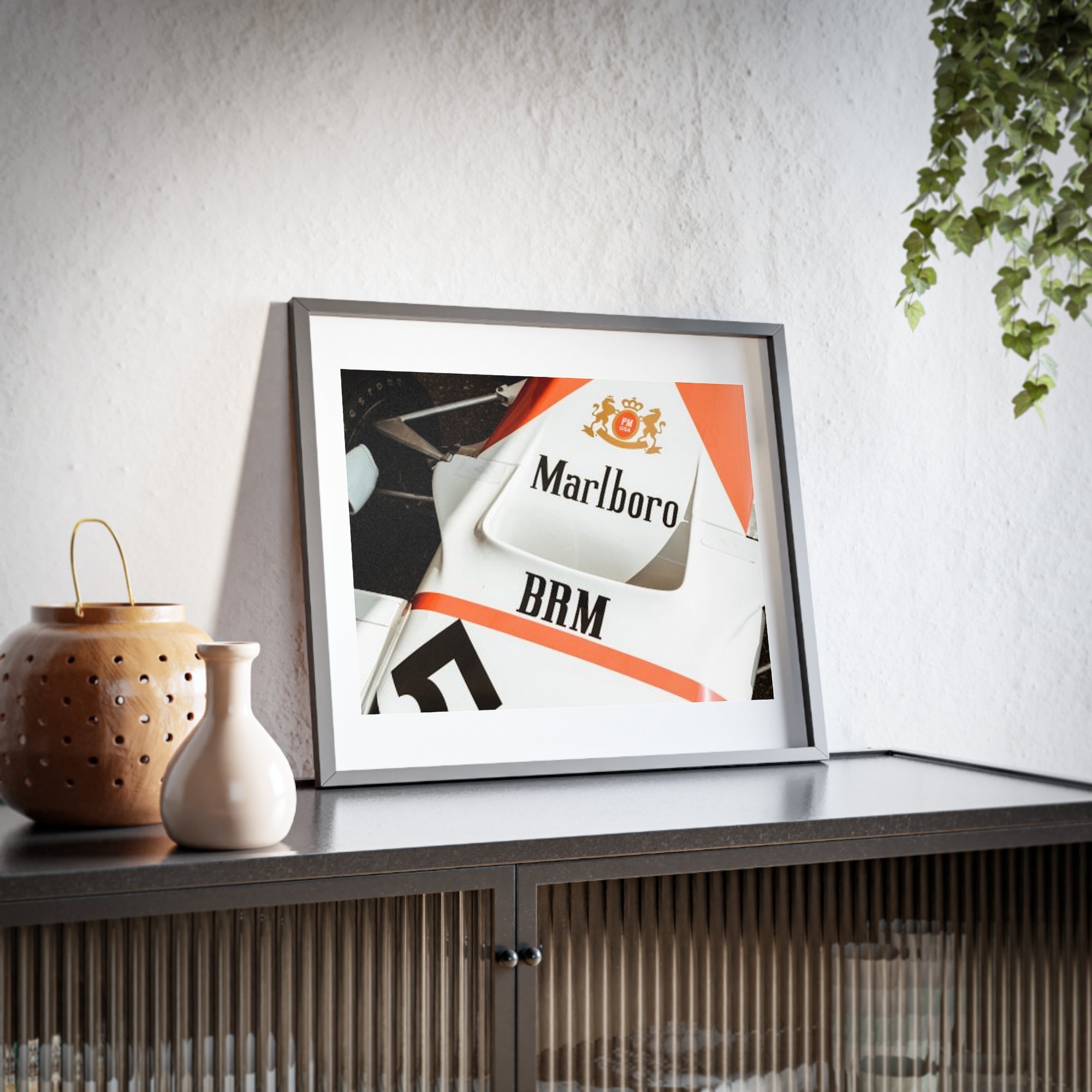 An old vintage formula one car close up of the classic Marlboro livery on the nose of the car with the suspension and tires showing.