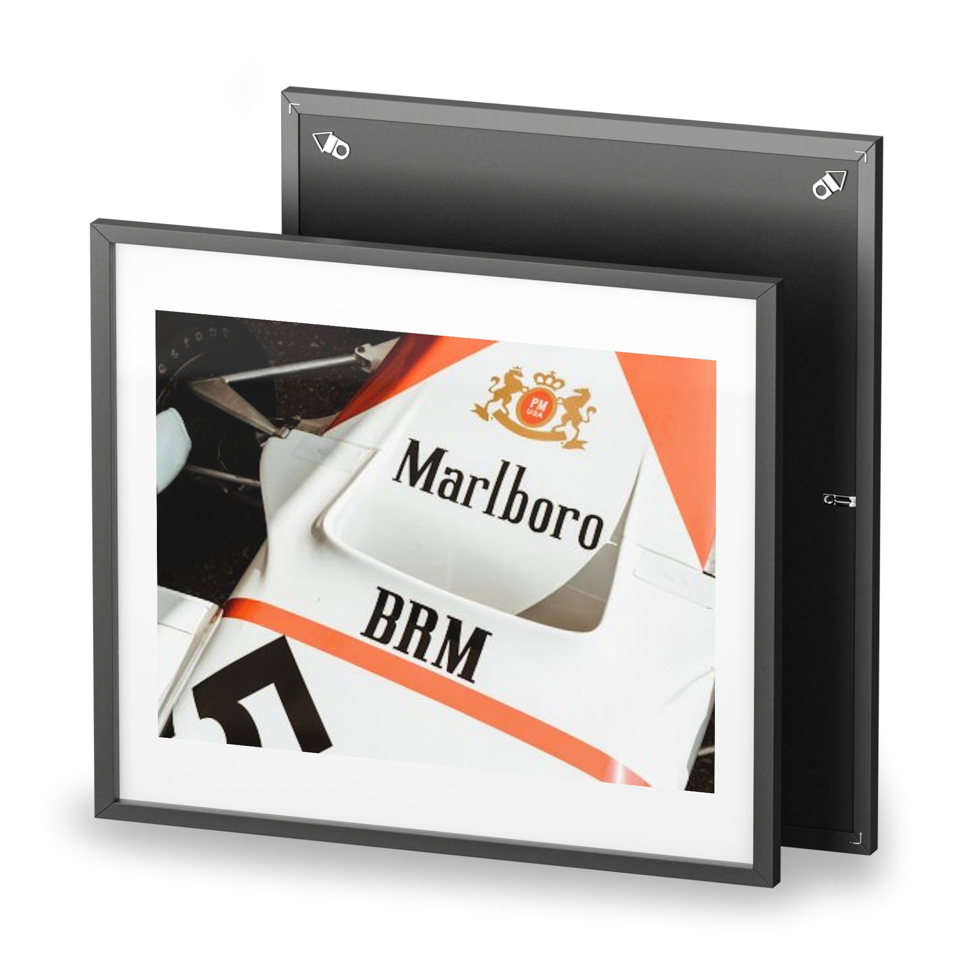 An old vintage formula one car close up of the classic Marlboro livery on the nose of the car with the suspension and tires showing.