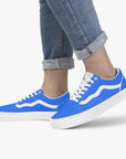 Volt Lows sneakers worn by model - combining vintage racing aesthetics with modern street style.