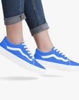 Volt Lows sneakers worn by model - combining vintage racing aesthetics with modern street style.