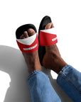 The Red's pool slides, red and white strap on black sole, worn with jeans