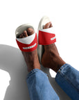 The Red's pool slides, red and white strap on white sole, worn with jeans